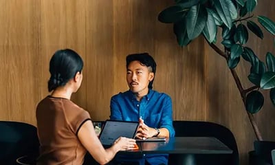 Sales Consultant discussing the project timelines with her key contact